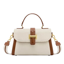Bolsa feminina estruturada AVONNUE em tom claro com alça marrom e fecho dourado, design sofisticado e atemporal.